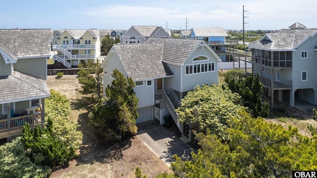 birds eye view of property with a residential view