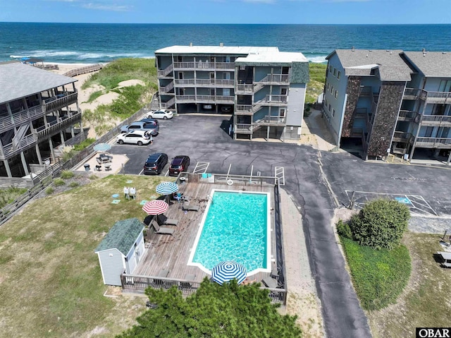 birds eye view of property with a water view