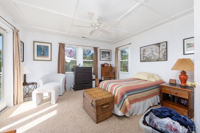 bedroom featuring ceiling fan, coffered ceiling, and light colored carpet