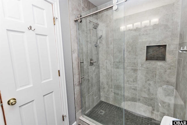 full bath featuring a shower stall