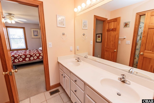 ensuite bathroom featuring ensuite bath, visible vents, a sink, and tile patterned floors