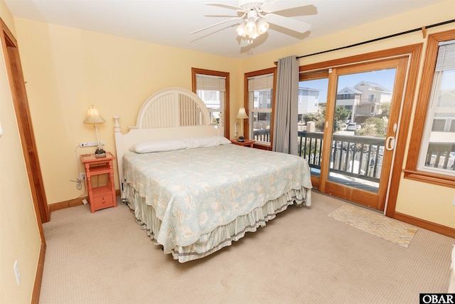 bedroom with baseboards, a ceiling fan, light colored carpet, and access to exterior