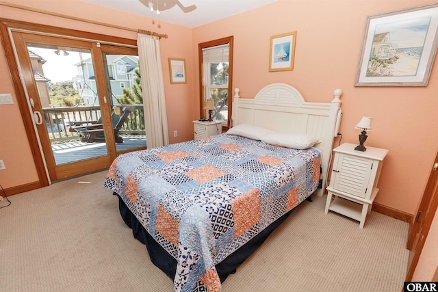 bedroom featuring light carpet, access to outside, multiple windows, and baseboards