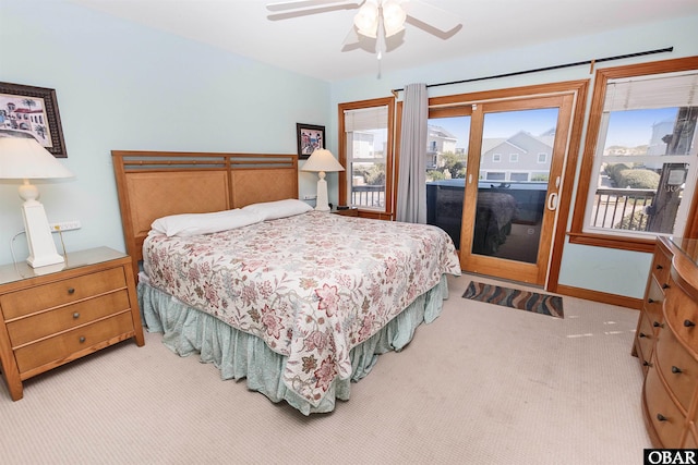 bedroom with access to outside, light colored carpet, ceiling fan, and baseboards