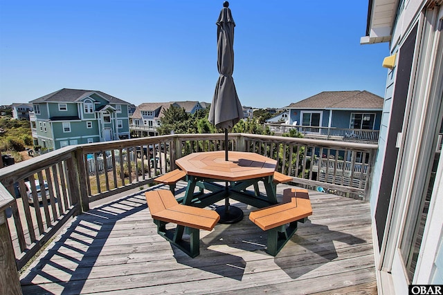 wooden deck with a residential view