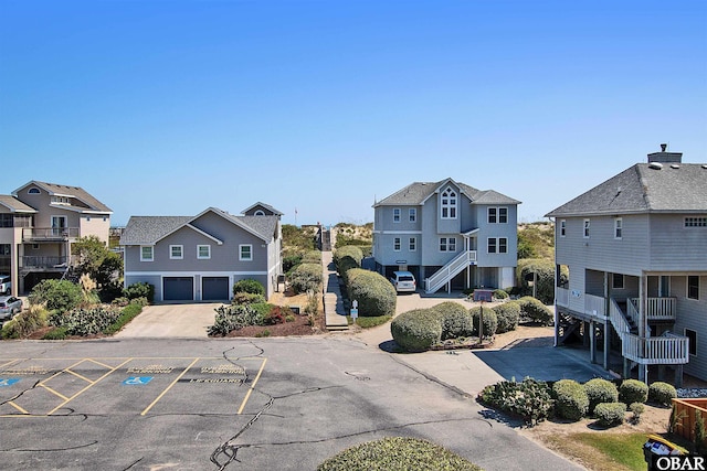 view of street with a residential view and stairway