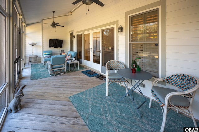 wooden deck featuring ceiling fan