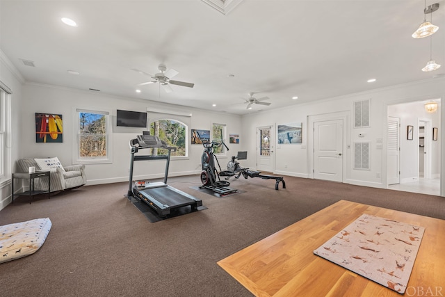 exercise room with ornamental molding, recessed lighting, visible vents, and baseboards