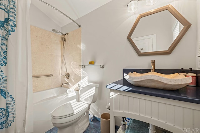 bathroom with a sink, toilet, vaulted ceiling, and shower / bath combination with curtain