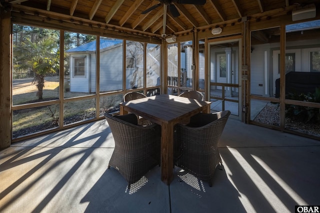 unfurnished sunroom with a ceiling fan