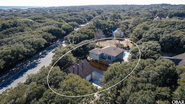 bird's eye view featuring a forest view