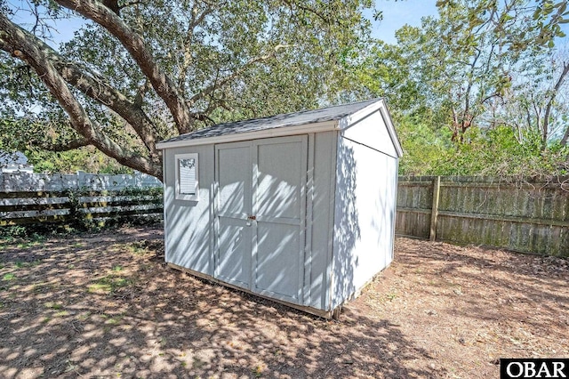 view of shed with a fenced backyard