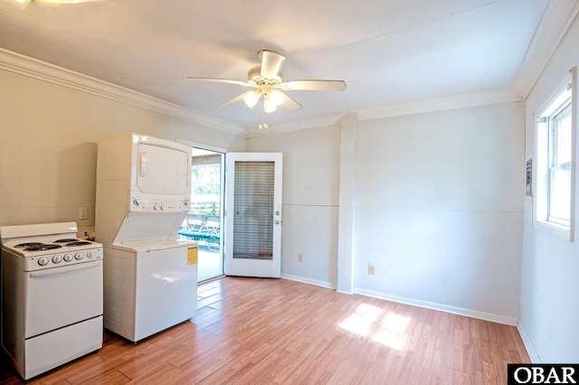 clothes washing area featuring light wood-style flooring, ornamental molding, stacked washing maching and dryer, laundry area, and baseboards