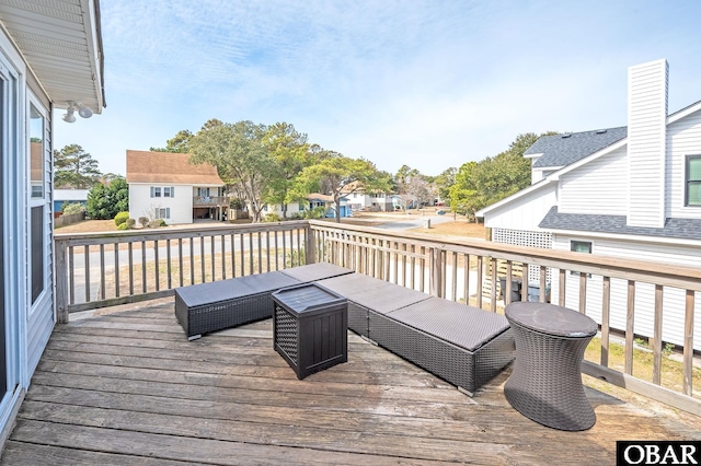 wooden terrace with a residential view