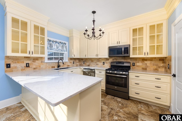 kitchen with stainless steel appliances, hanging light fixtures, glass insert cabinets, and a peninsula