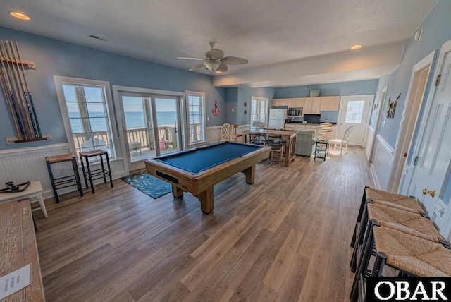 22183 Sea Gull St Lot 13, Rodanthe, NC 27968 - rec room with billiards, wood finished floors, ceiling fan, and a textured ceiling