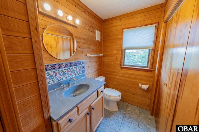 26224 Cutlass Ln Lot 27, Salvo, NC 27972 - bathroom with vanity, wood walls, and tile patterned floors