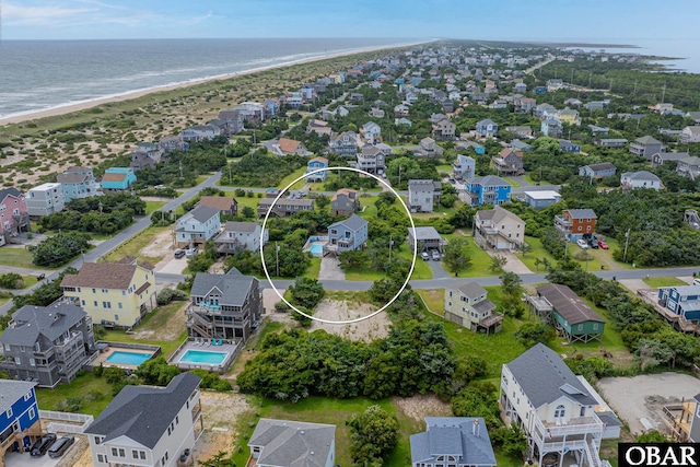 26224 Cutlass Ln Lot 27, Salvo, NC 27972 - aerial perspective of suburban area featuring expansive beach and a pool area
