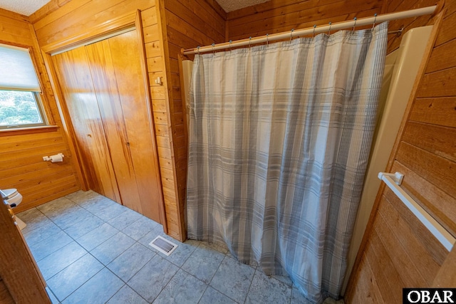 26224 Cutlass Ln Lot 27, Salvo, NC 27972 - full bath featuring wooden walls, tile patterned floors, and curtained shower