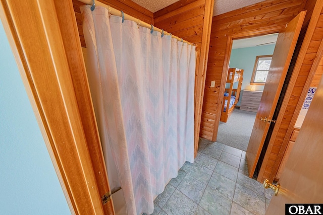 26224 Cutlass Ln Lot 27, Salvo, NC 27972 - bathroom with wood walls and a shower with shower curtain
