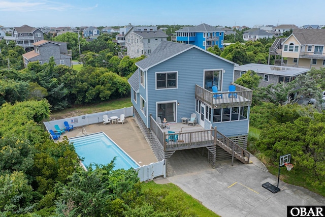 26224 Cutlass Ln Lot 27, Salvo, NC 27972 - back of property with a balcony, a fenced backyard, and stairs