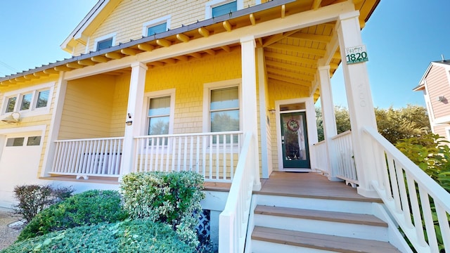 doorway to property featuring covered porch