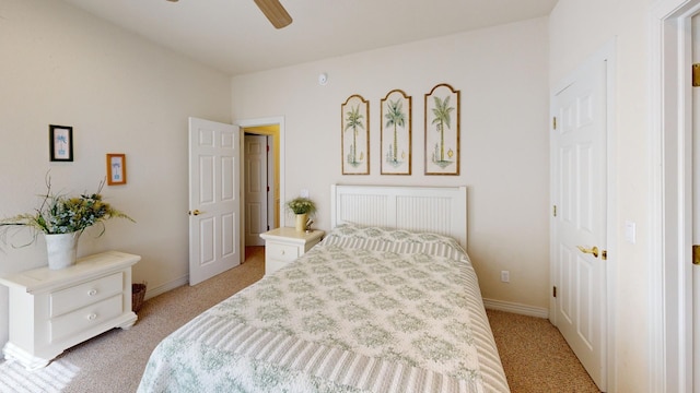 bedroom with baseboards and a ceiling fan