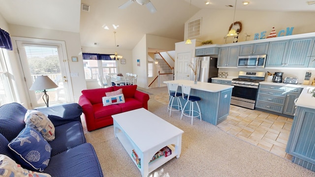 kitchen with light countertops, appliances with stainless steel finishes, visible vents, and pendant lighting