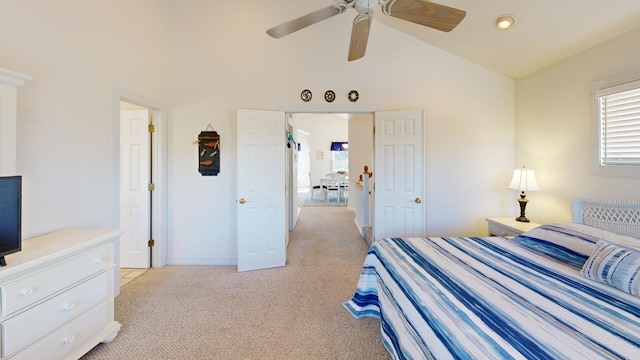 bedroom with high vaulted ceiling, light carpet, ceiling fan, and baseboards