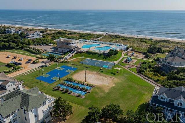 bird's eye view featuring a water view, a residential view, and a view of the beach