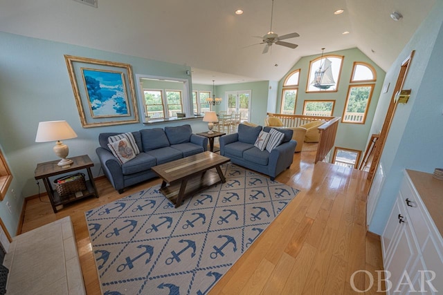 living room with light wood-type flooring, baseboards, vaulted ceiling, and recessed lighting