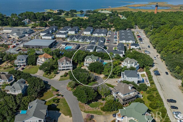 bird's eye view with a residential view and a water view