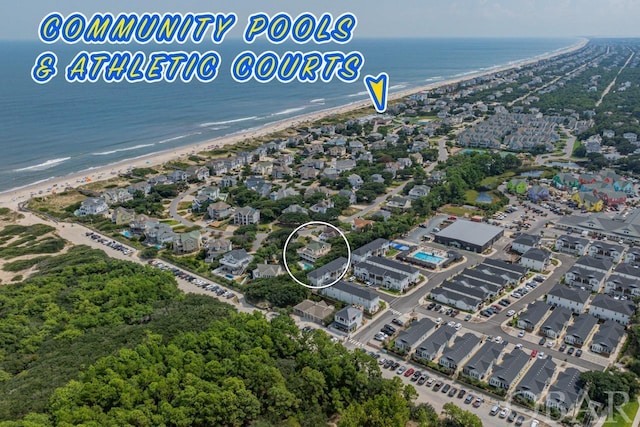 bird's eye view featuring a water view and a view of the beach