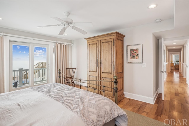 bedroom with recessed lighting, wood finished floors, a ceiling fan, access to exterior, and baseboards