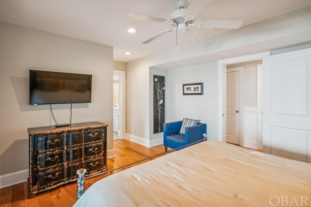 bedroom featuring baseboards, wood finished floors, a ceiling fan, and recessed lighting