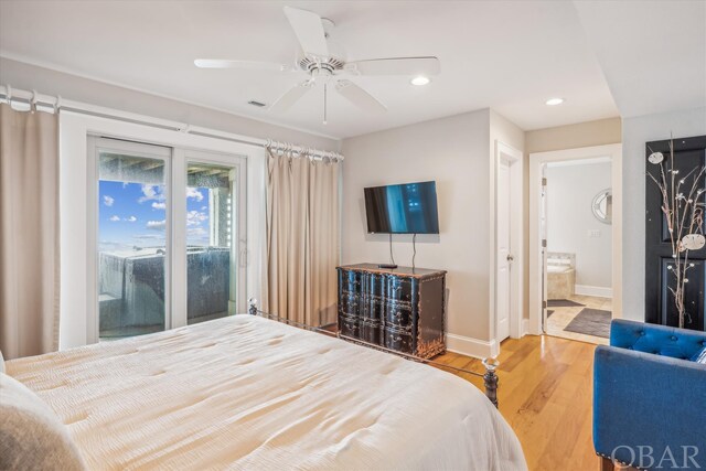 bedroom featuring recessed lighting, visible vents, ensuite bath, wood finished floors, and baseboards