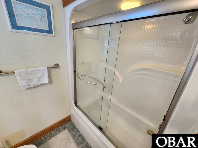 bathroom featuring tile patterned flooring and baseboards