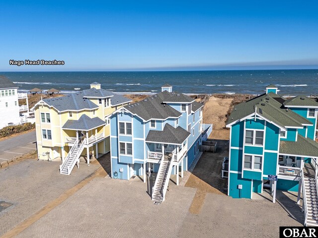 birds eye view of property featuring a water view and a residential view