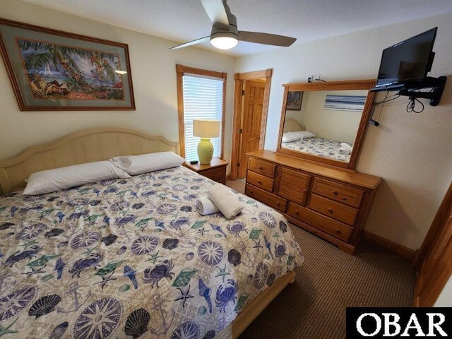 bedroom with carpet floors, a ceiling fan, and baseboards