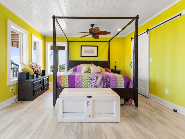 1556 Sandpiper Rd Lot # 33, Corolla, NC 27927 - bedroom featuring wood ceiling, wood finished floors, multiple windows, and a barn door
