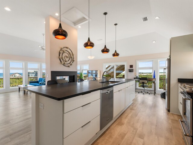 1556 Sandpiper Rd Lot # 33, Corolla, NC 27927 - kitchen featuring open floor plan, appliances with stainless steel finishes, a sink, and dark countertops