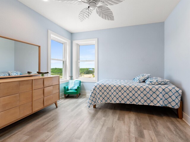 1556 Sandpiper Rd Lot # 33, Corolla, NC 27927 - bedroom featuring baseboards, light wood-type flooring, and a ceiling fan