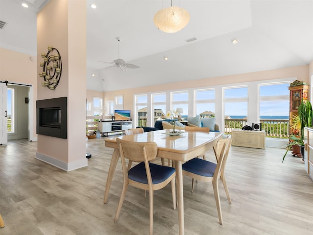 1556 Sandpiper Rd Lot # 33, Corolla, NC 27927 - dining space featuring high vaulted ceiling, visible vents, and light wood-style flooring