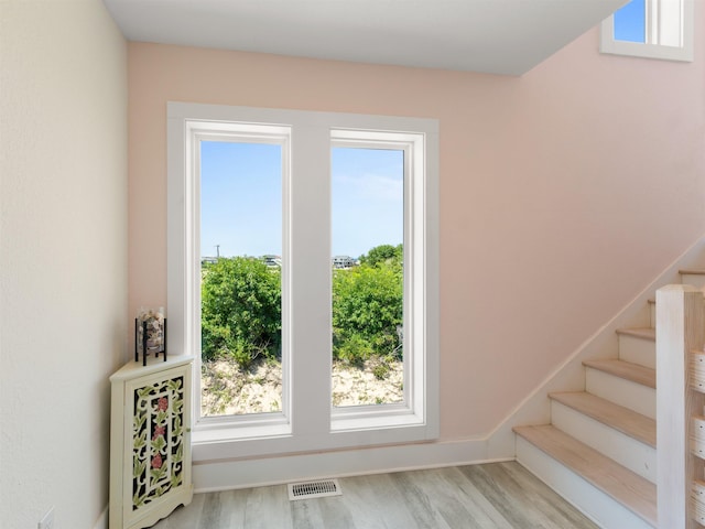 1556 Sandpiper Rd Lot # 33, Corolla, NC 27927 - entryway featuring wood finished floors, visible vents, and stairway