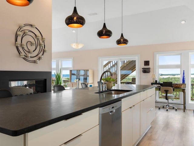 1556 Sandpiper Rd Lot # 33, Corolla, NC 27927 - kitchen with dishwasher, a sink, white cabinetry, and dark countertops