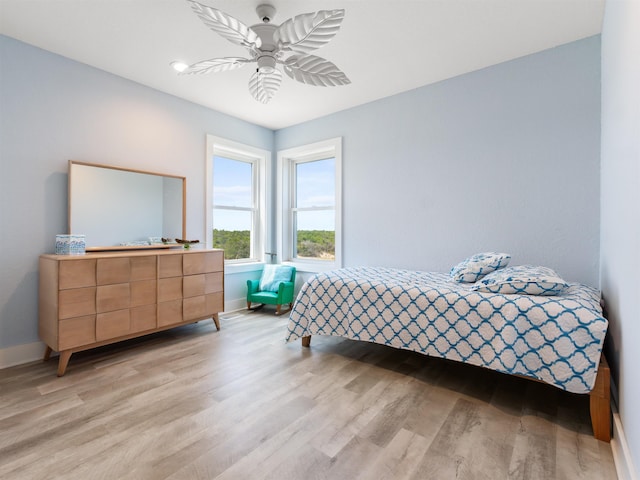 1556 Sandpiper Rd Lot # 33, Corolla, NC 27927 - bedroom featuring light wood-style floors, baseboards, and a ceiling fan