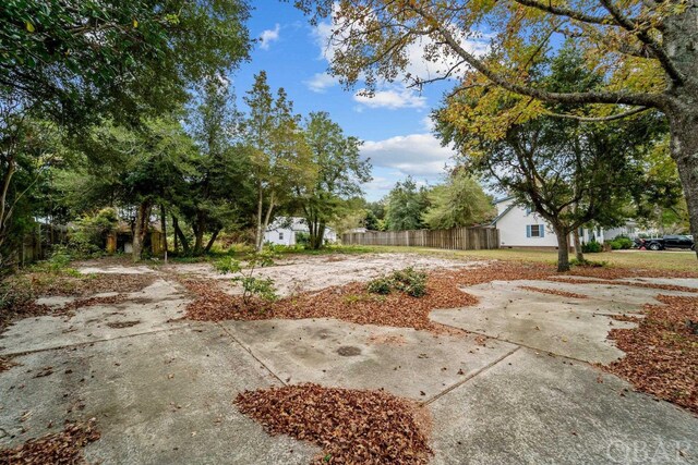 view of yard featuring a patio area and fence