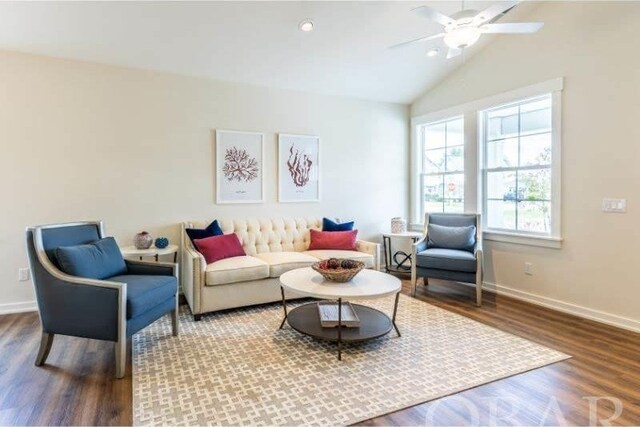 living area with recessed lighting, a ceiling fan, vaulted ceiling, wood finished floors, and baseboards