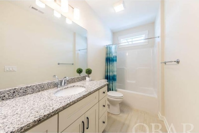 full bath with toilet, shower / tub combo, visible vents, and vanity