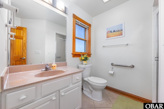 full bathroom with baseboards, toilet, a shower with shower door, tile patterned flooring, and vanity